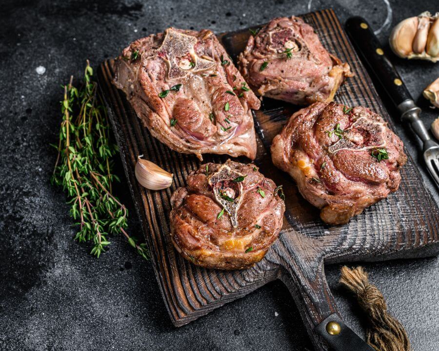 Roasted Karoo lamb neck cuts on a board
